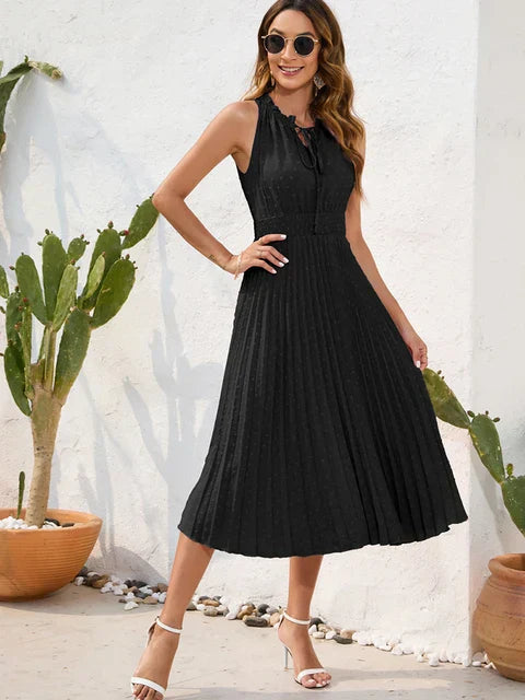 Tania - Élégante robe midi sans manches à œillets plissée