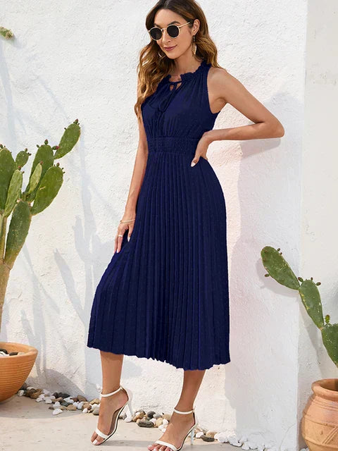 Tania - Élégante robe midi sans manches à œillets plissée