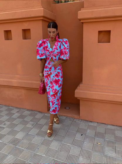 Bella - Robe midi fleurie et dynamique à manches bouffantes