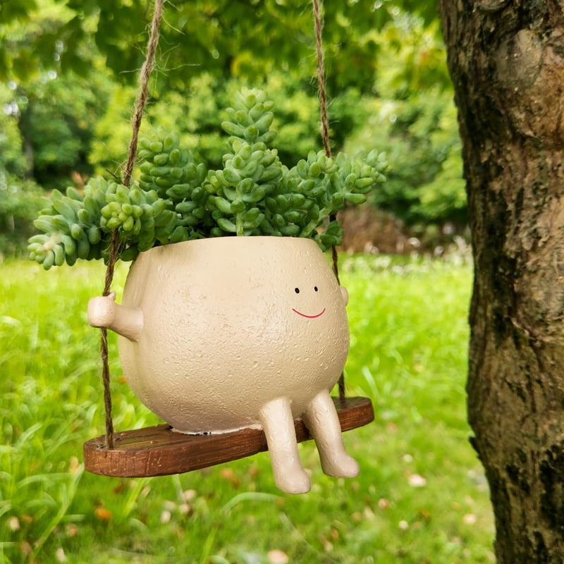 Coffre à plantes souriant en rocking chair