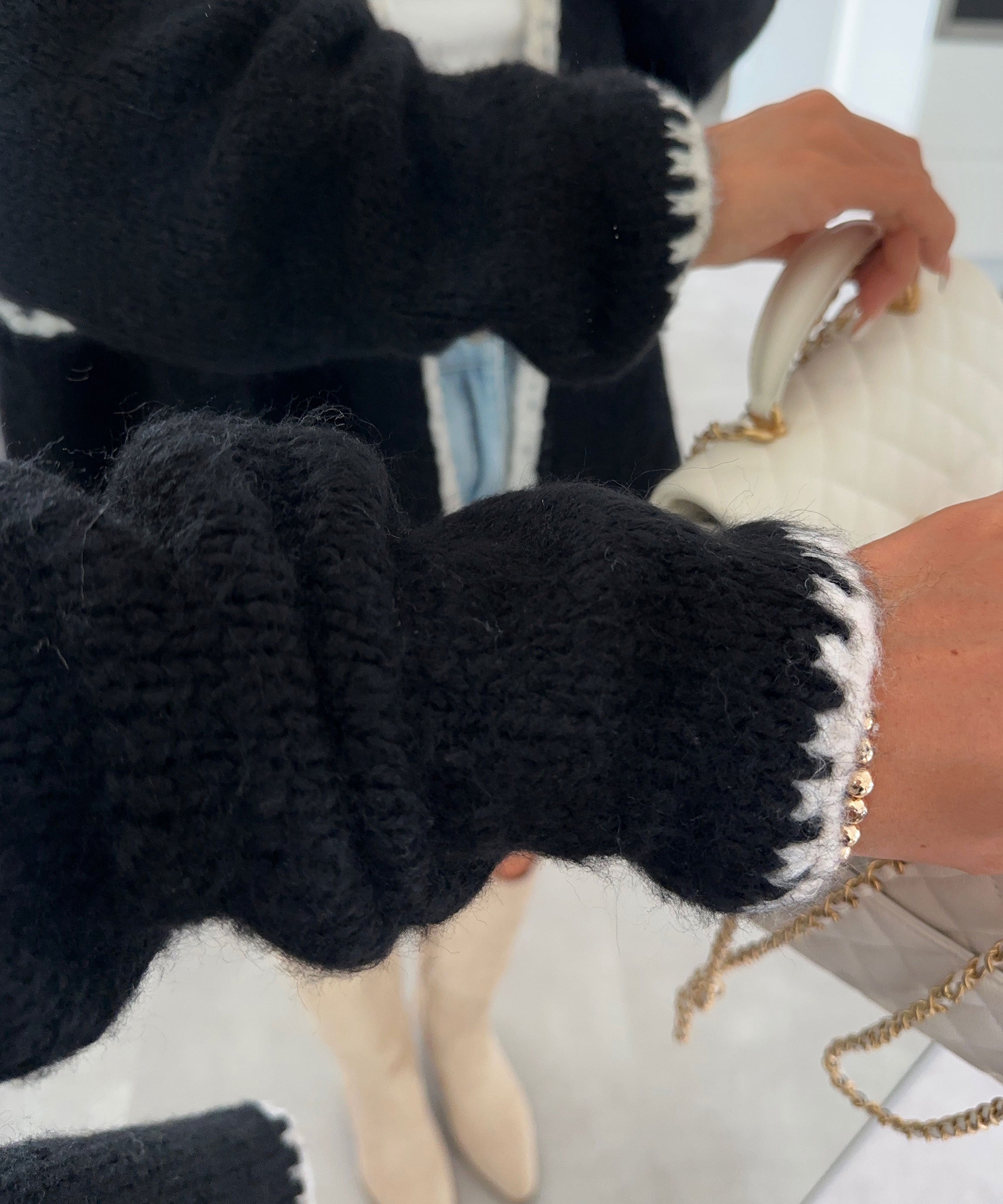 Veste en maille noire Hera - style sans effort et sophistication douillette