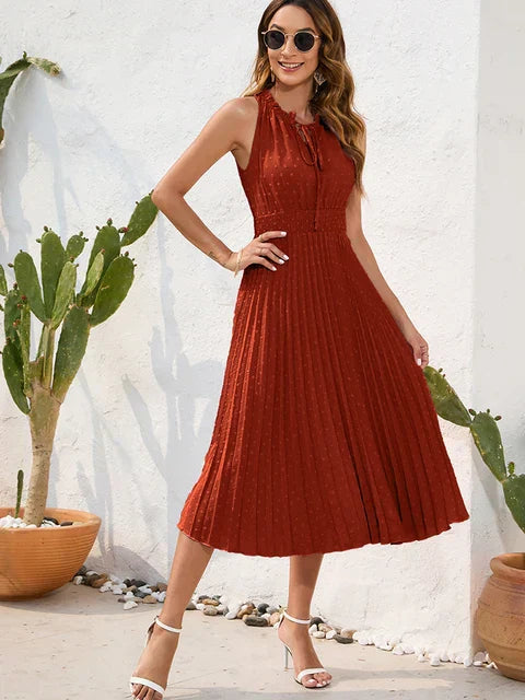 Tania - Élégante robe midi sans manches à œillets plissée
