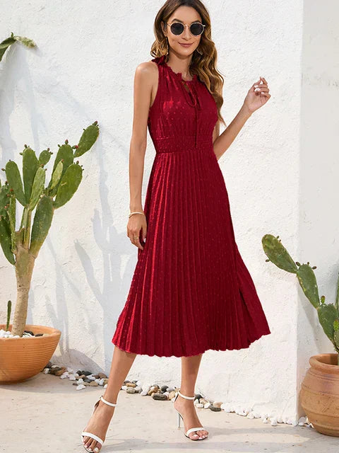 Tania - Élégante robe midi sans manches à œillets plissée