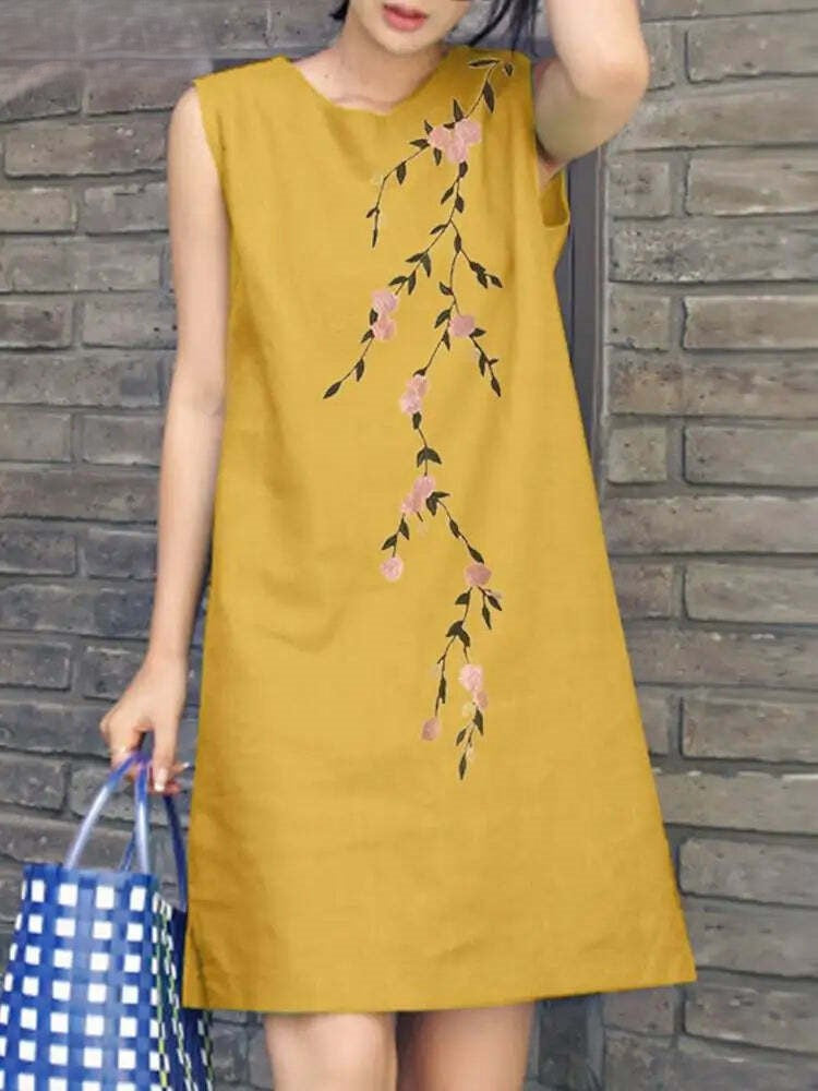 Esther - Robe de cocktail brodée sans manches